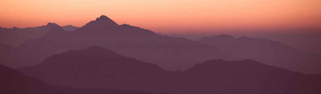 Amazing sunset through the hill and mountains